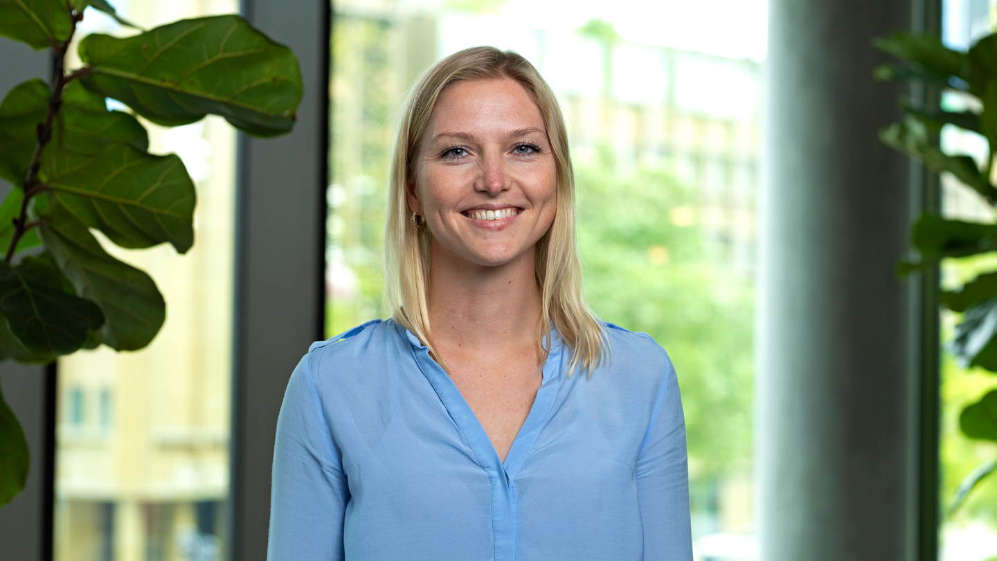 Blonde female manager looking into the camera and smiling