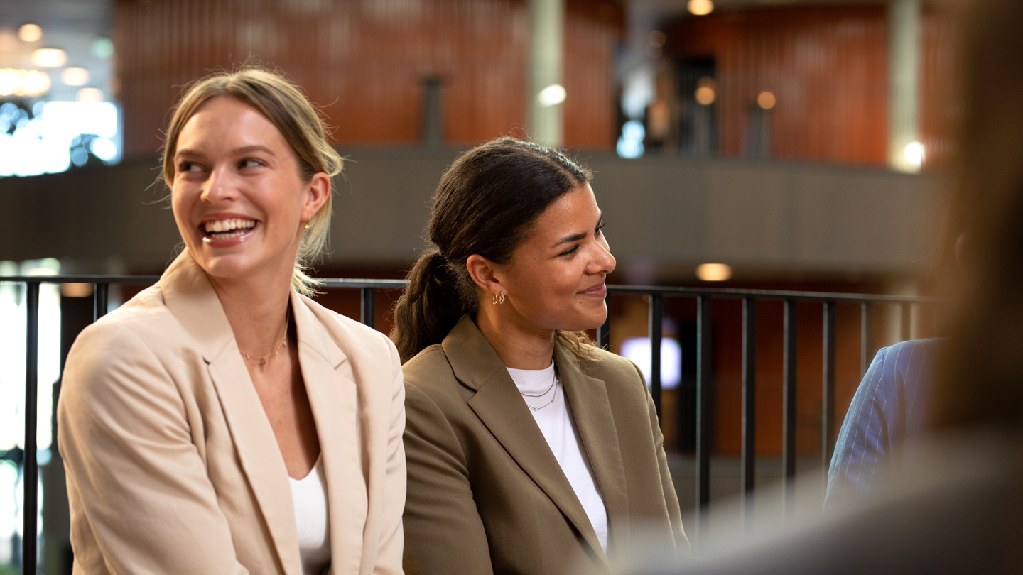 Two women smiling in the office