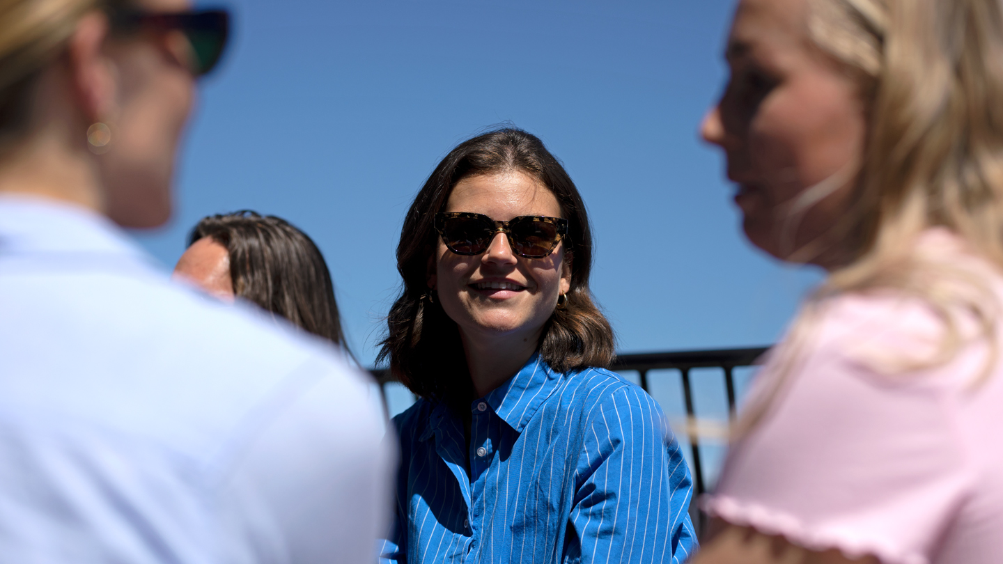 Woman sitting in the sun with sunglasses on