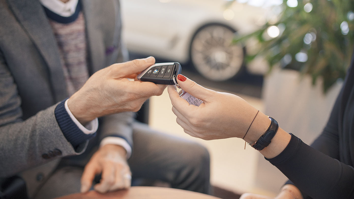 Man is giving a key to a woman