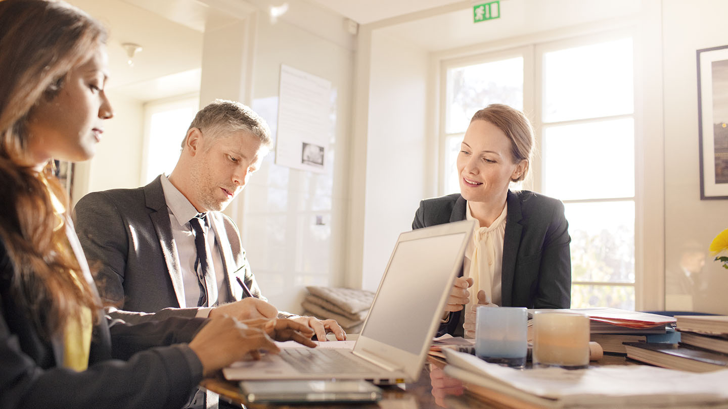 3 people in a meeting